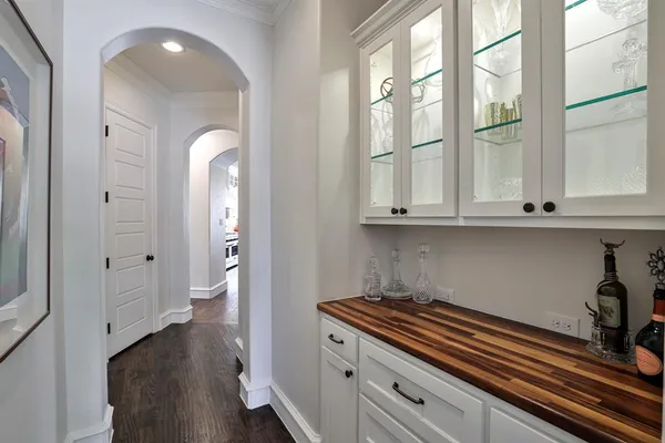 a kitchen with stainless steel appliances granite countertop a stove and a wooden floors