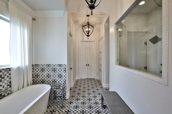 a bathroom with a bathtub and shower