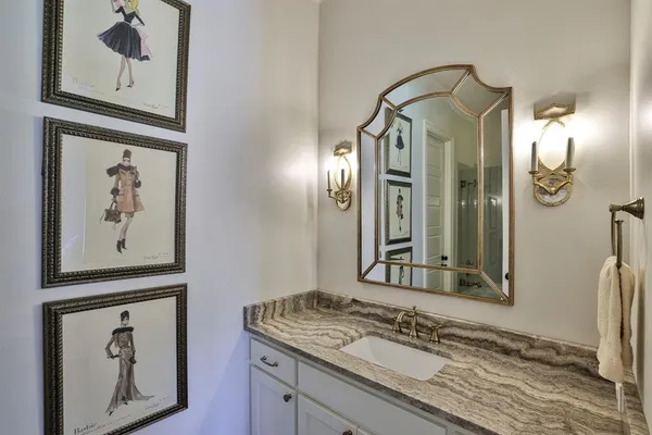 a bathroom with a mirror and a sink