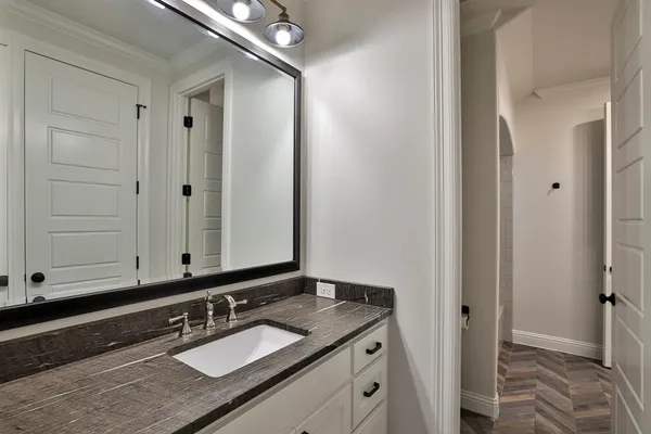 a bathroom with a sink and a mirror