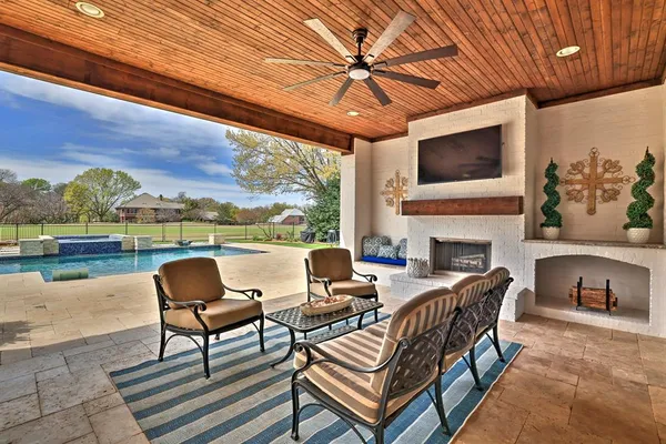 a outdoor space with patio furniture and garden view
