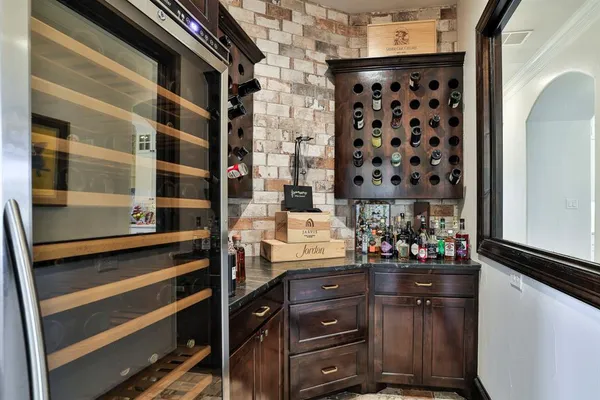 a room with mirror cabinets and window