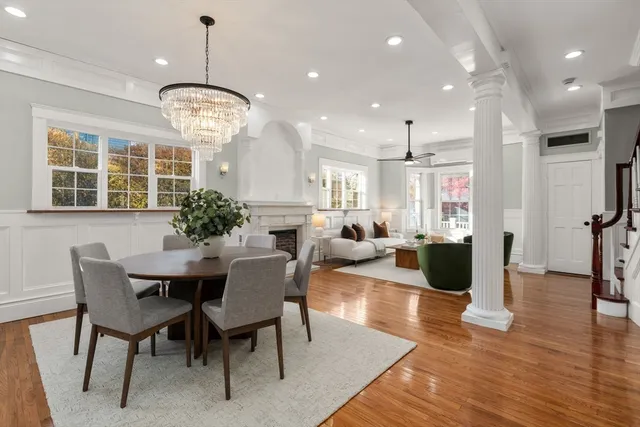 a kitchen with a sink a stove and chairs