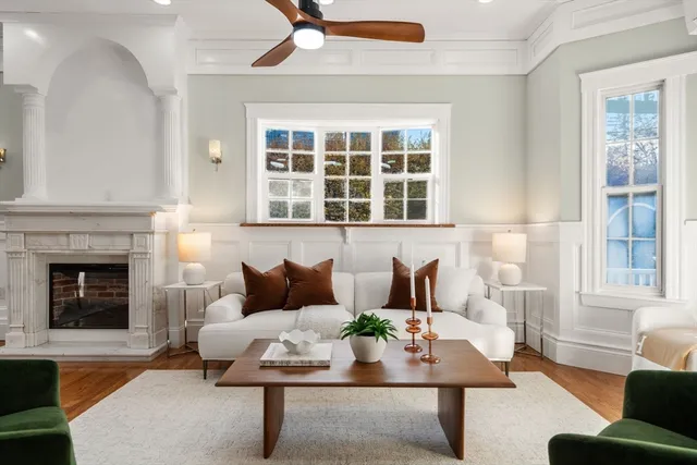 a kitchen with stainless steel appliances granite countertop a sink a stove a refrigerator and island with wooden floor