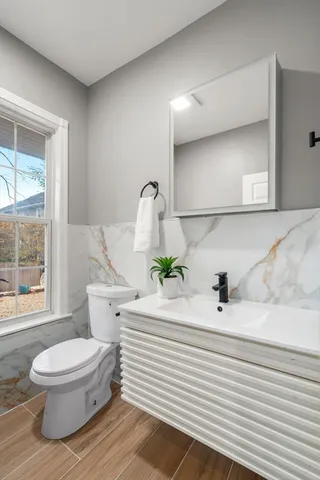 a bedroom with two beds and a large window