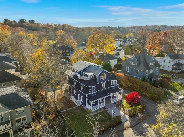a black white and white photo of a white building