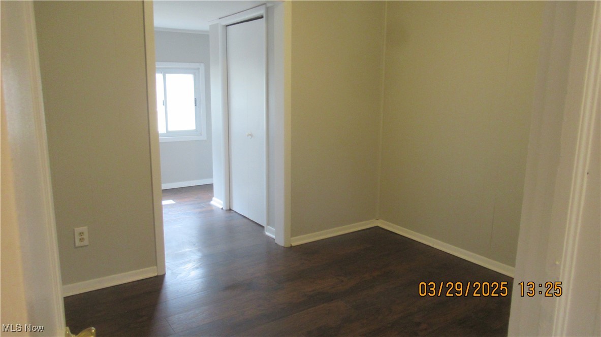 36505 Pettibone Road Solon, OH 44139 - Photo 11 of 24 Spare room featuring baseboards and dark wood-style flooring