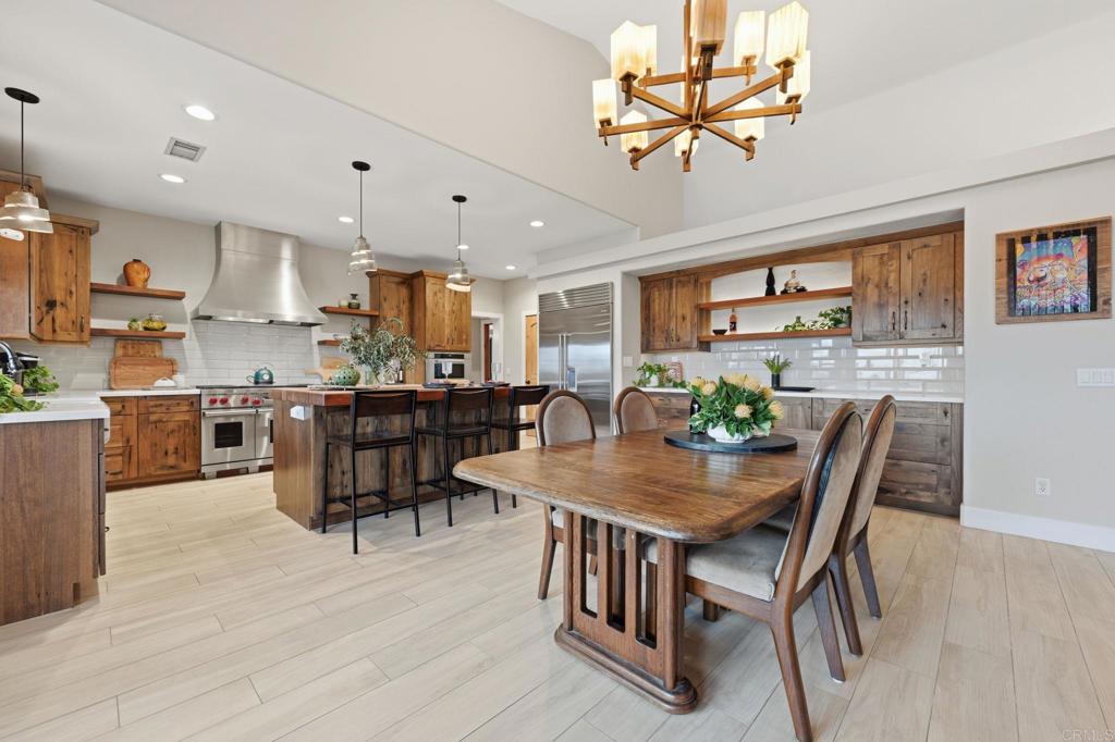 1655 Colina Vista Fallbrook, CA 92028 - Photo 11 of 63 a view of a dining room with furniture and wooden floor