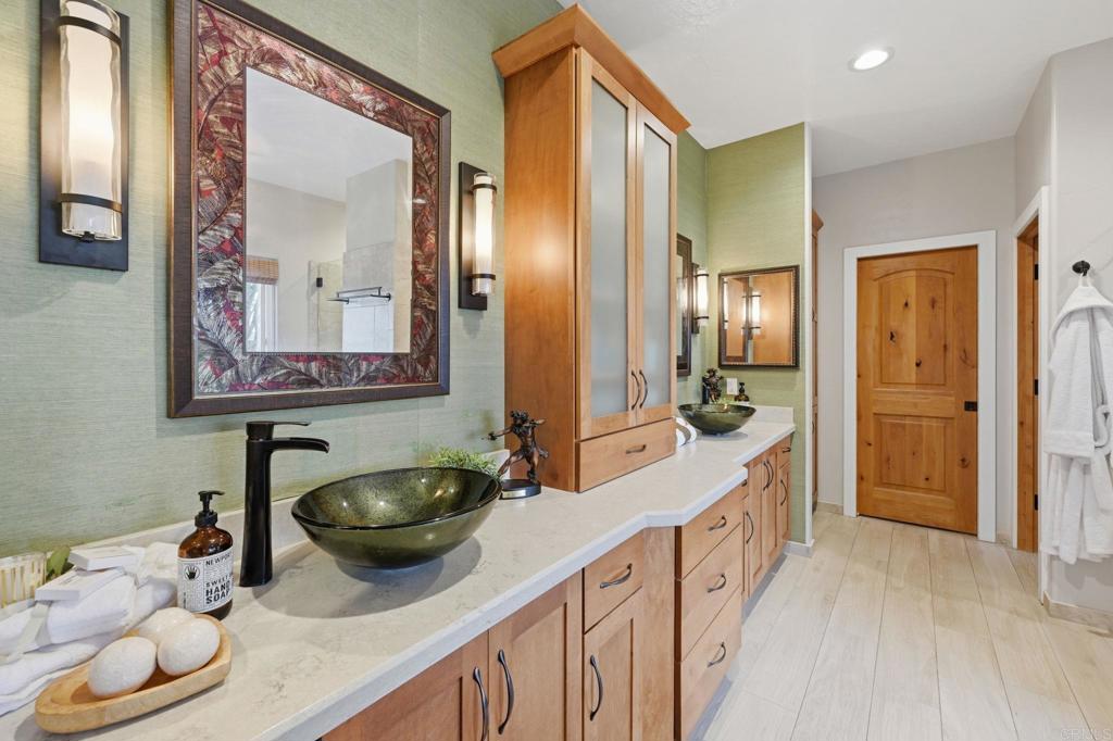 1655 Colina Vista Fallbrook, CA 92028 - Photo 20 of 63 a bathroom with a sink and a mirror