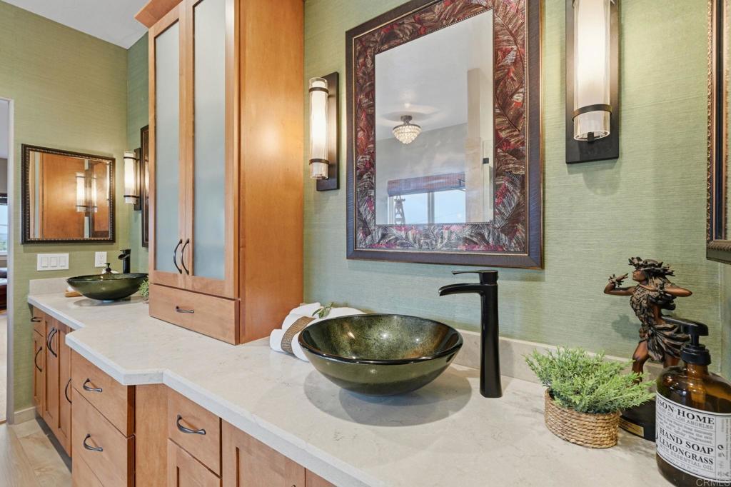 1655 Colina Vista Fallbrook, CA 92028 - Photo 21 of 63 a bathroom with a sink and a mirror