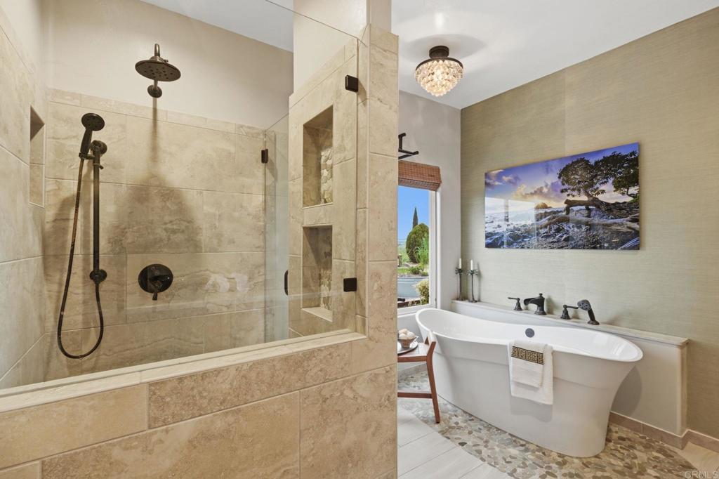 1655 Colina Vista Fallbrook, CA 92028 - Photo 22 of 63 a bathroom with a tub sink shower and a mirror