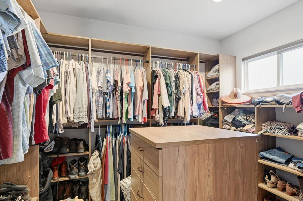 1655 Colina Vista Fallbrook, CA 92028 - Photo 24 of 63 a view of walk in closet with clothes and shoes