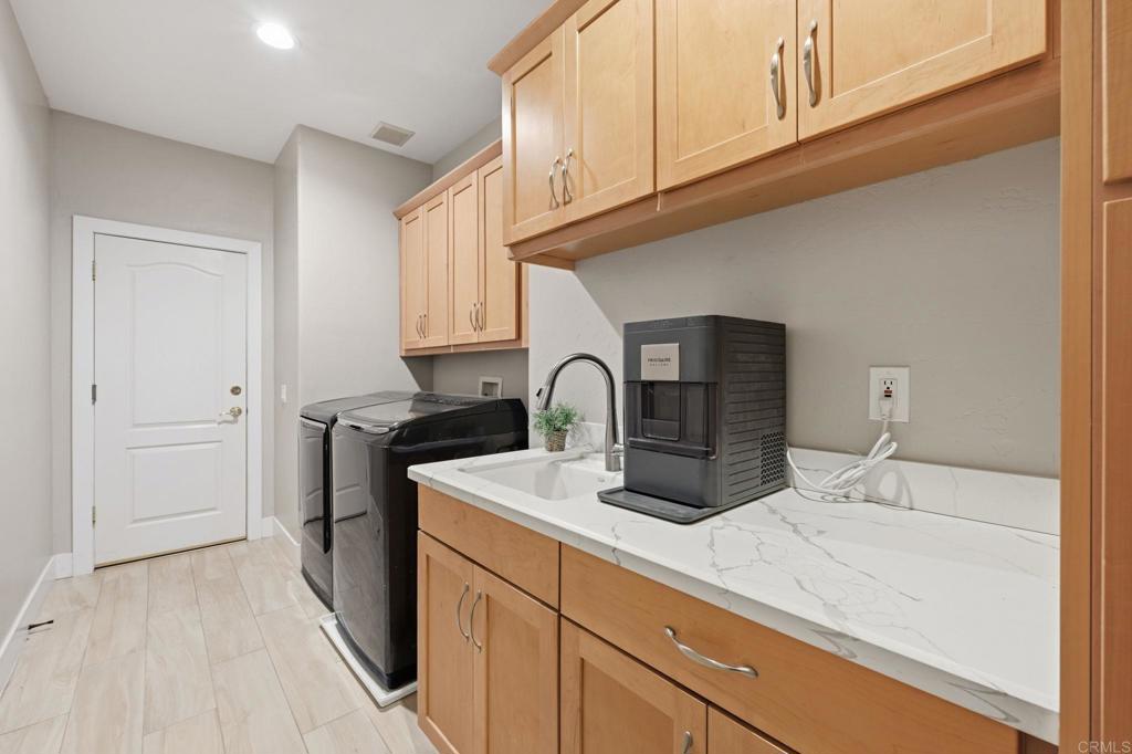 1655 Colina Vista Fallbrook, CA 92028 - Photo 31 of 63 a kitchen with stainless steel appliances granite countertop a sink and cabinets