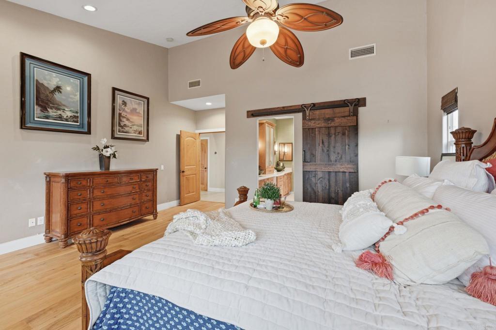 1655 Colina Vista Fallbrook, CA 92028 - Photo 33 of 63 a bedroom with a bed and wooden floor