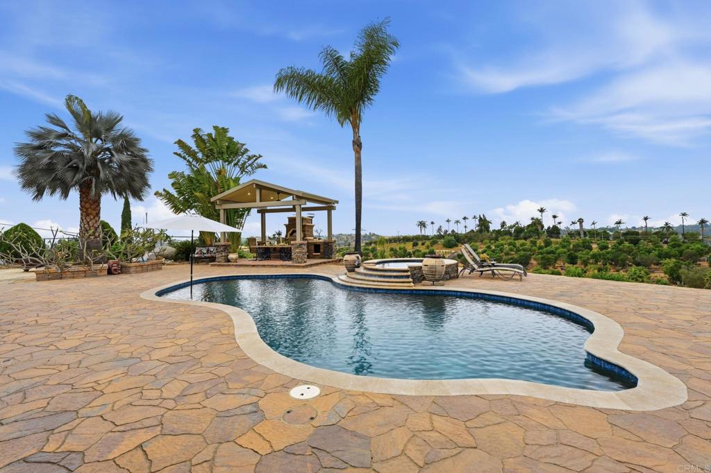1655 Colina Vista Fallbrook, CA 92028 - Photo 39 of 63 a view of a swimming pool and a chair