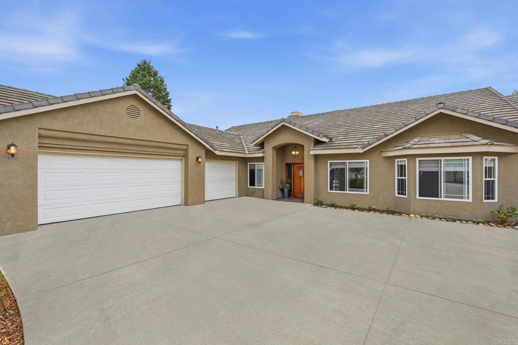 1655 Colina Vista Fallbrook, CA 92028 - Photo 58 of 63 a front view of a house with a yard and garage