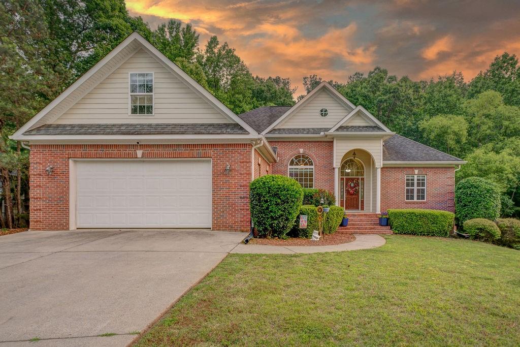 12 Brookhollow Road Rome, GA 30165 - Photo 1 of 1 a front view of a house with a yard and garage