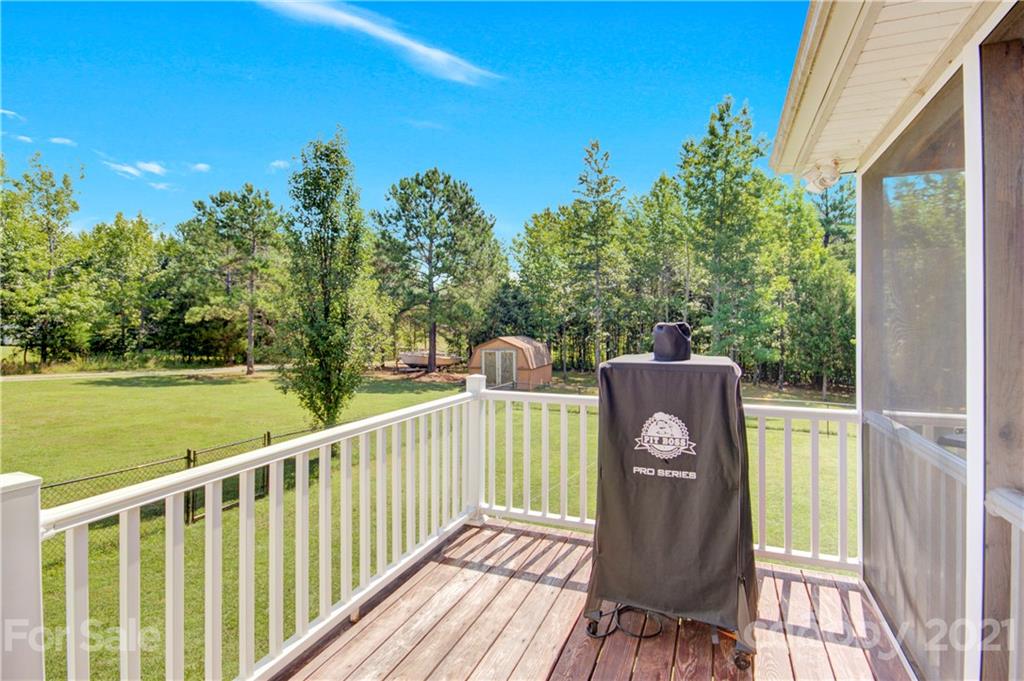 3520 Mack Ballard Road Maiden, NC 28650 - Photo 11 of 25 a view of a balcony with wooden floor and outdoor space