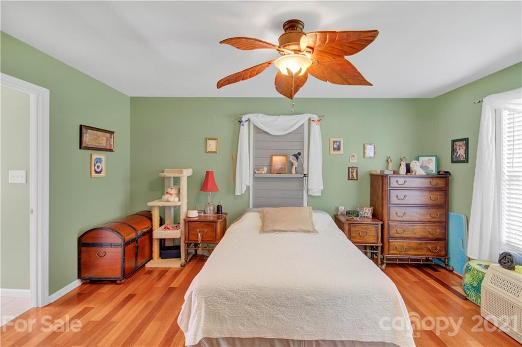 3520 Mack Ballard Road Maiden, NC 28650 - Photo 21 of 25 a bedroom with bed and wooden floor