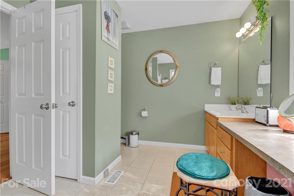 3520 Mack Ballard Road Maiden, NC 28650 - Photo 23 of 25 a bathroom with a granite countertop sink a toilet and a mirror