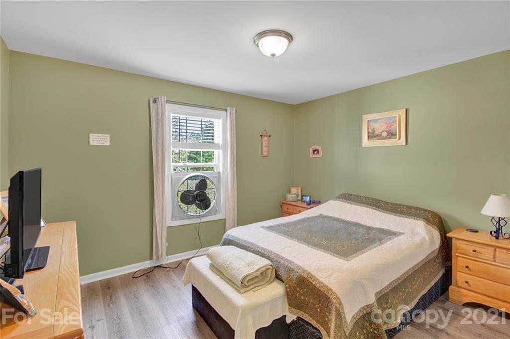 3520 Mack Ballard Road Maiden, NC 28650 - Photo 24 of 25 a bedroom with a bed and a flat screen tv