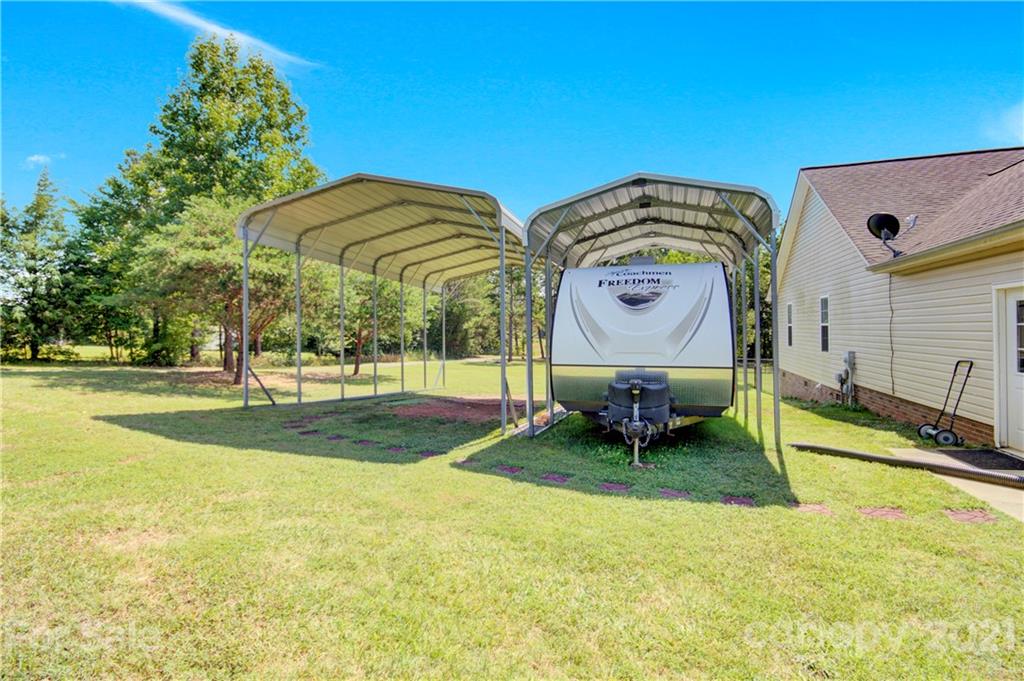 3520 Mack Ballard Road Maiden, NC 28650 - Photo 5 of 25 a swimming pool with outdoor seating and yard