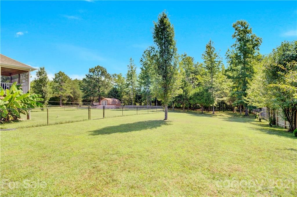 3520 Mack Ballard Road Maiden, NC 28650 - Photo 7 of 25 a swimming pool with trees in the background