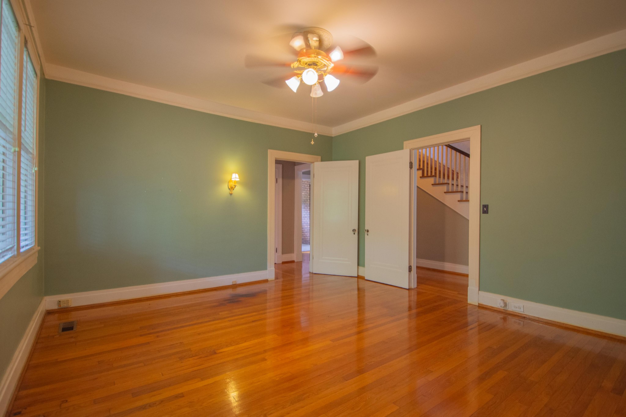 311 South 3rd Street Pulaski, TN 38478 - Photo 18 of 44 a view of an empty room with window and wooden floor