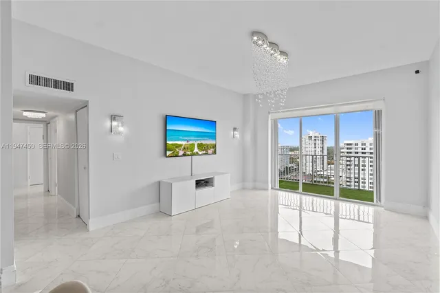 a view of a livingroom with furniture and chandelier