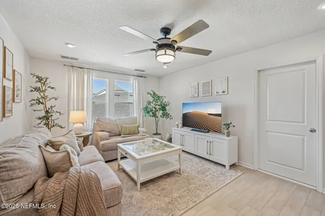 a view of a house with a yard and a garden