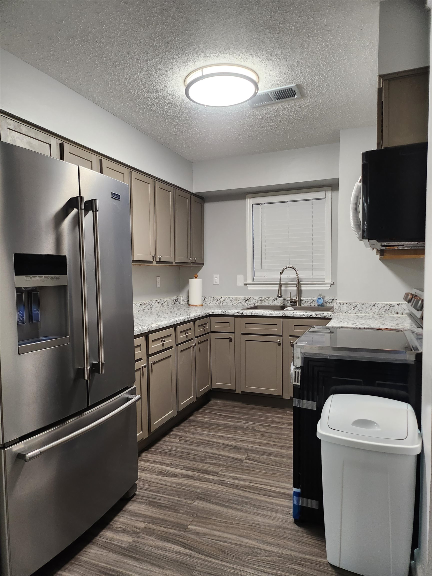 Undisclosed Address Marion, AR 72364 - Photo 12 of 12 a kitchen with a sink appliances and cabinets