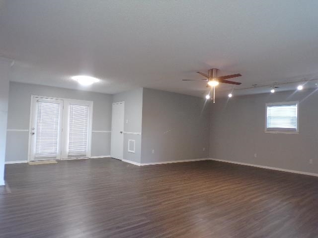 Undisclosed Address Marion, AR 72364 - Photo 4 of 12 a view of an empty room with wooden floor and a window