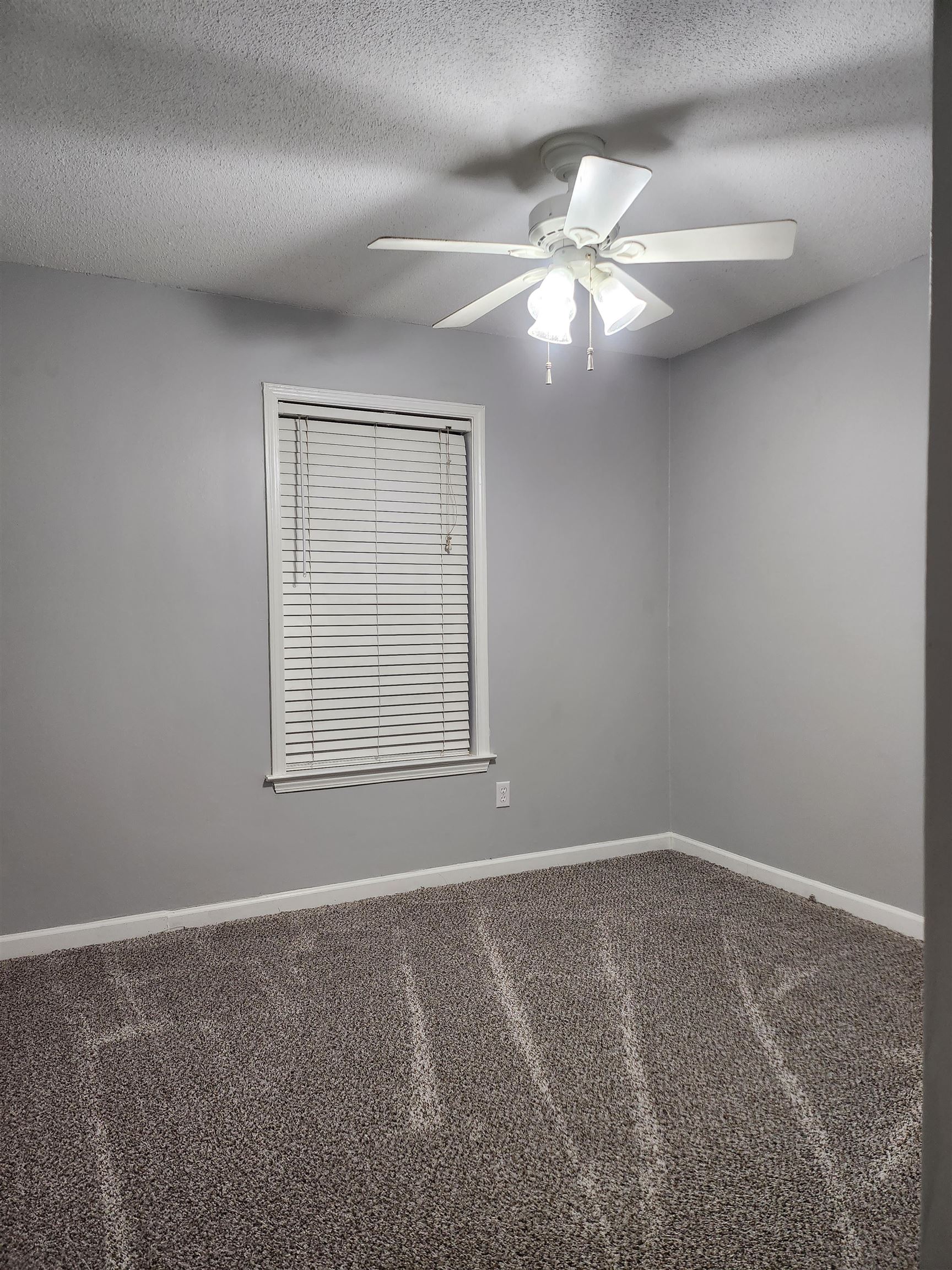 Undisclosed Address Marion, AR 72364 - Photo 8 of 12 a view of an empty room with a window