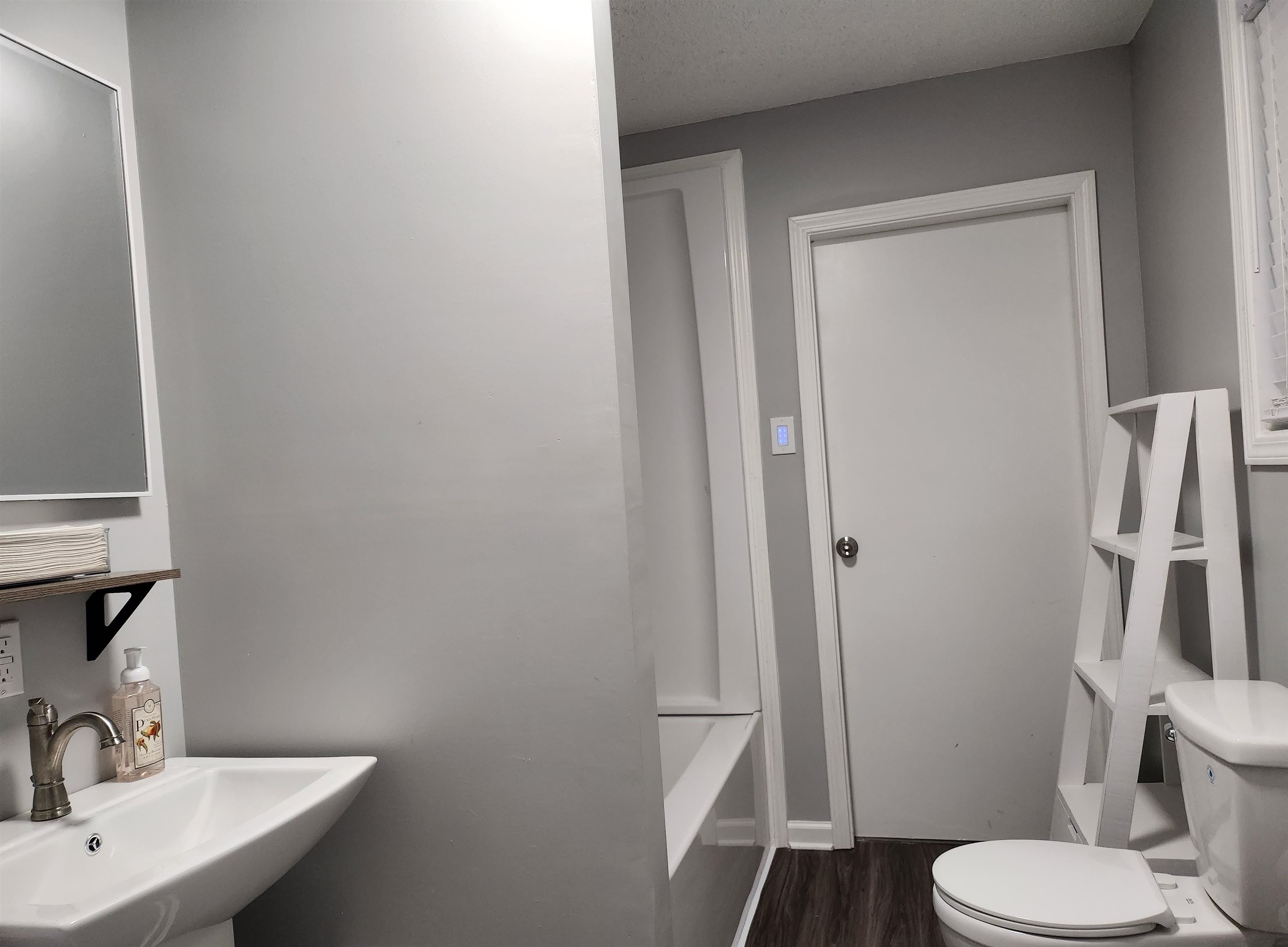 Undisclosed Address Marion, AR 72364 - Photo 10 of 12 a bathroom with a sink a toilet a mirror and shower