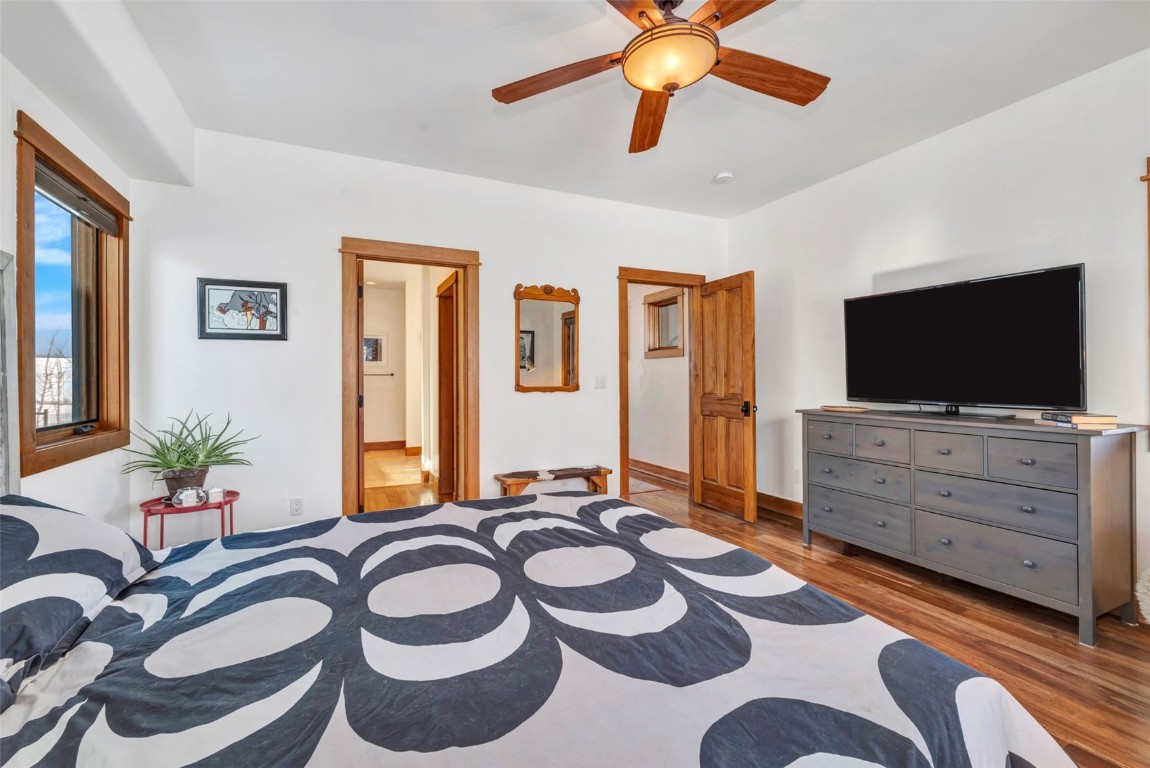 870 Dry Creek Road Hayden, CO 81639 - Photo 13 of 50 a bedroom with a bed and a flat screen tv