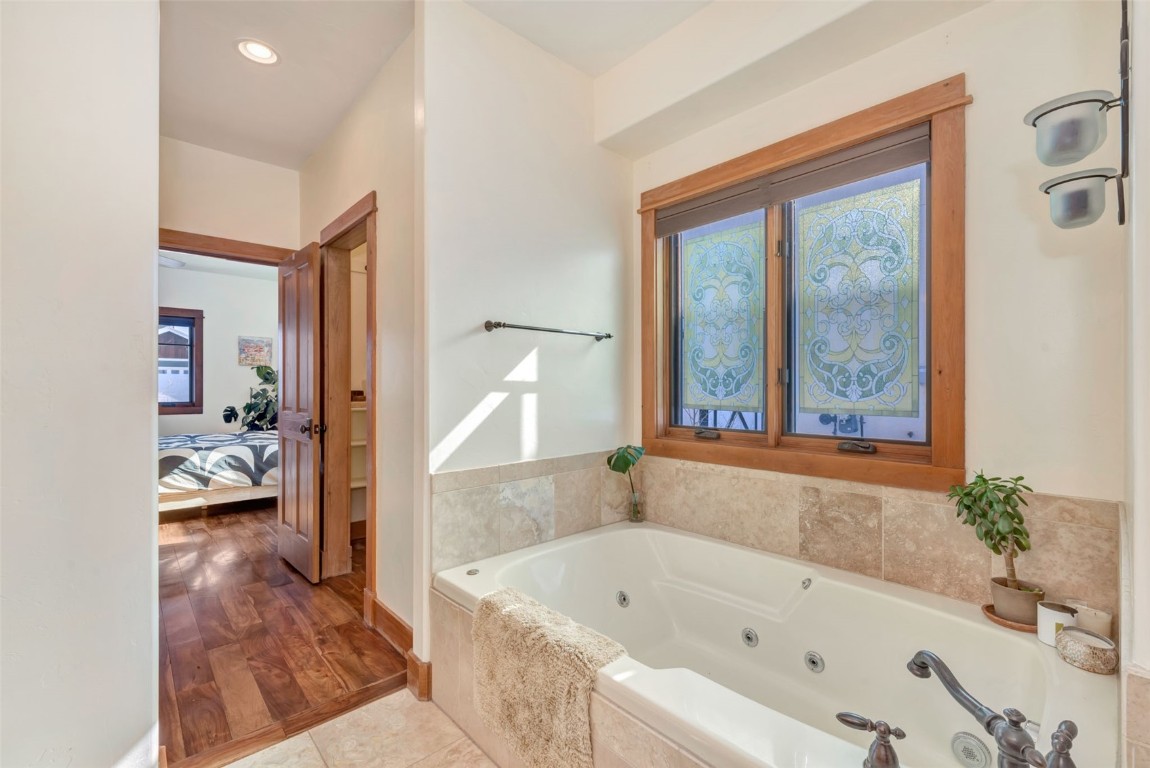 870 Dry Creek Road Hayden, CO 81639 - Photo 17 of 50 a bathroom with a tub shower and sink