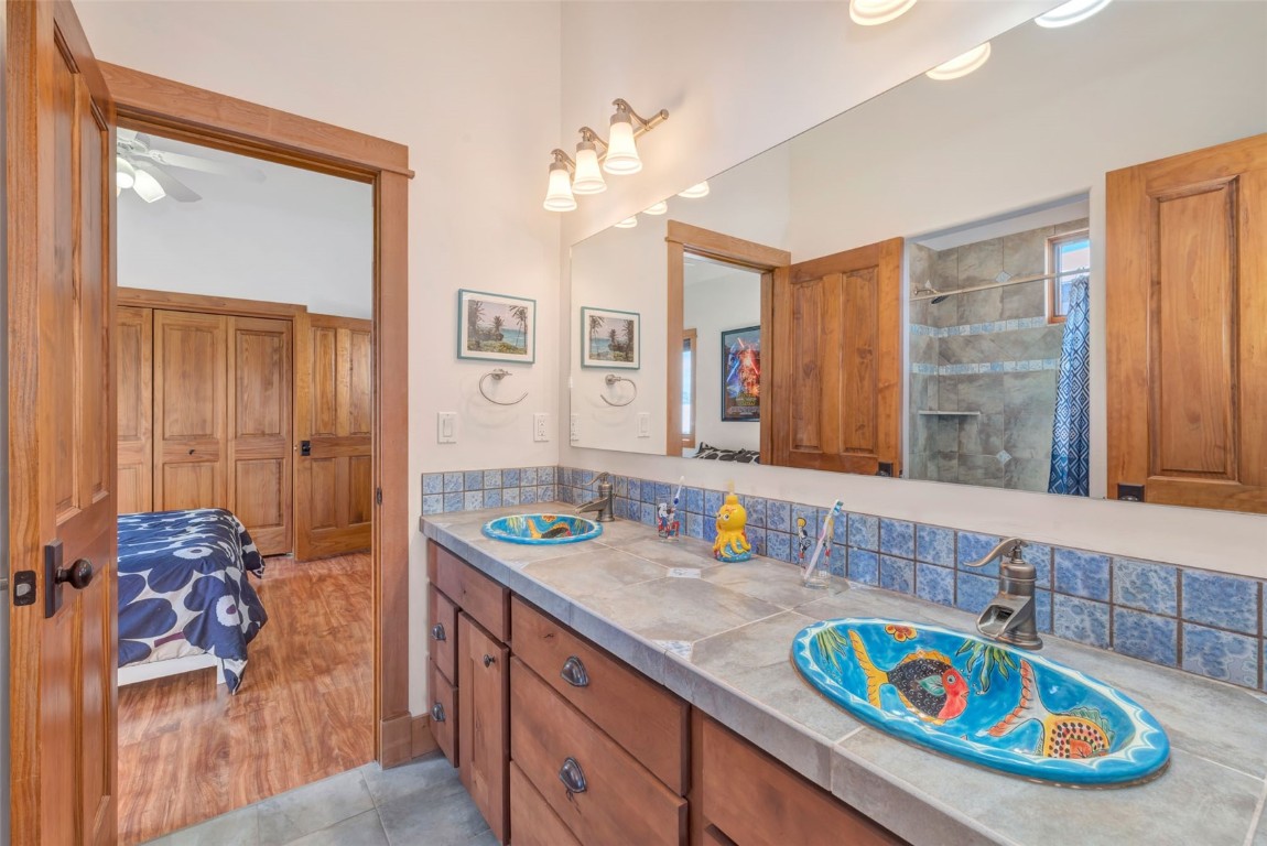 870 Dry Creek Road Hayden, CO 81639 - Photo 23 of 50 a bathroom with a sink a vanity and a mirror