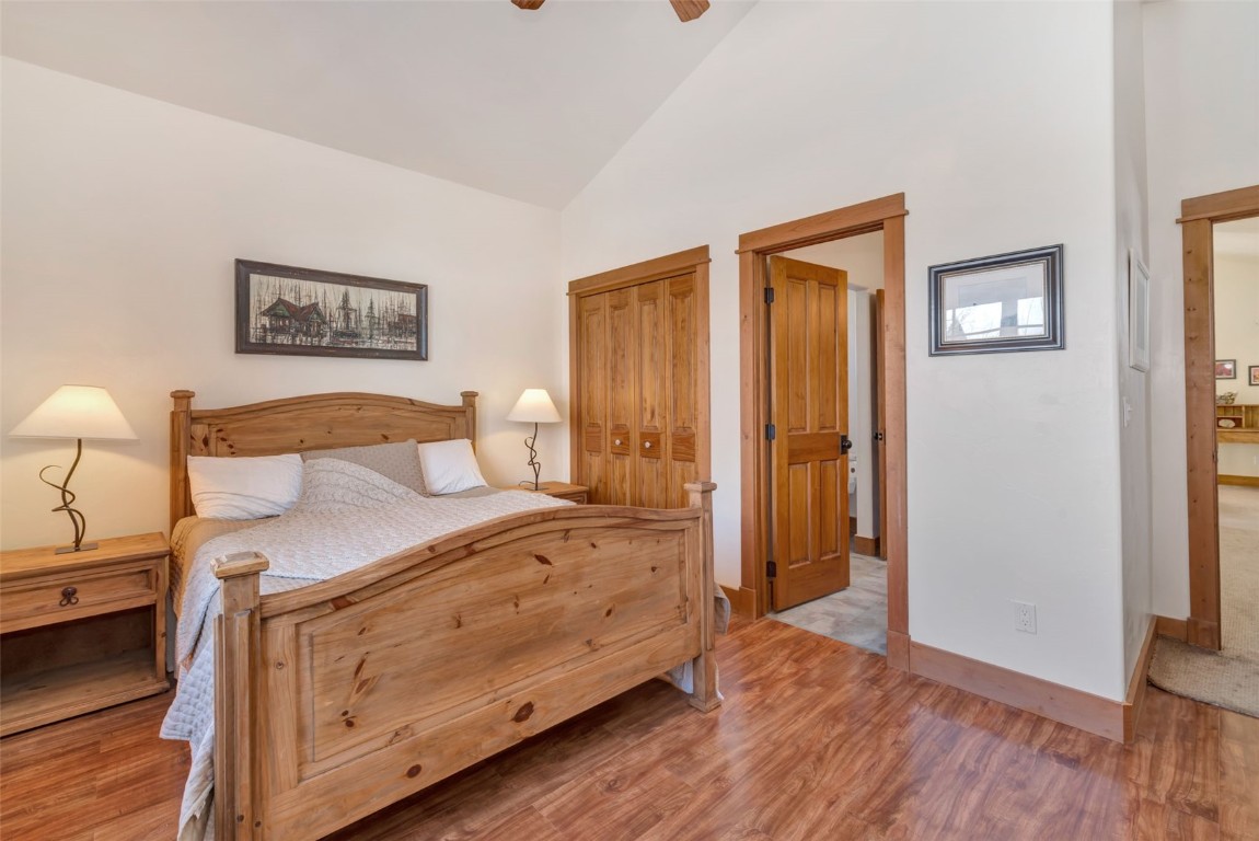 870 Dry Creek Road Hayden, CO 81639 - Photo 25 of 50 a bedroom with a bed and a lamp on dresser