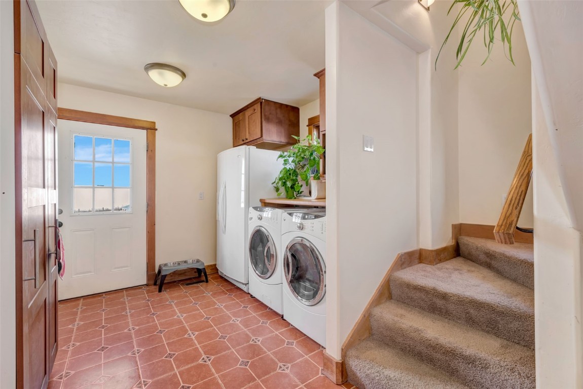 870 Dry Creek Road Hayden, CO 81639 - Photo 29 of 50 a view of a bedroom with washer and dryer