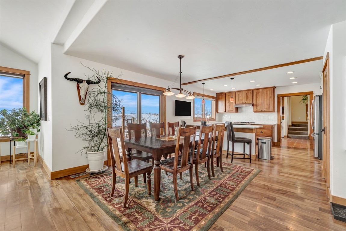 870 Dry Creek Road Hayden, CO 81639 - Photo 6 of 50 a dining room with furniture window and wooden floor