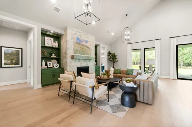 a living room with furniture and a fireplace