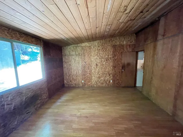 a view of an empty room with windows