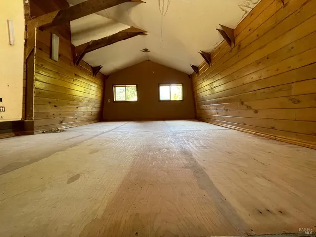 a view of an empty room with stairs