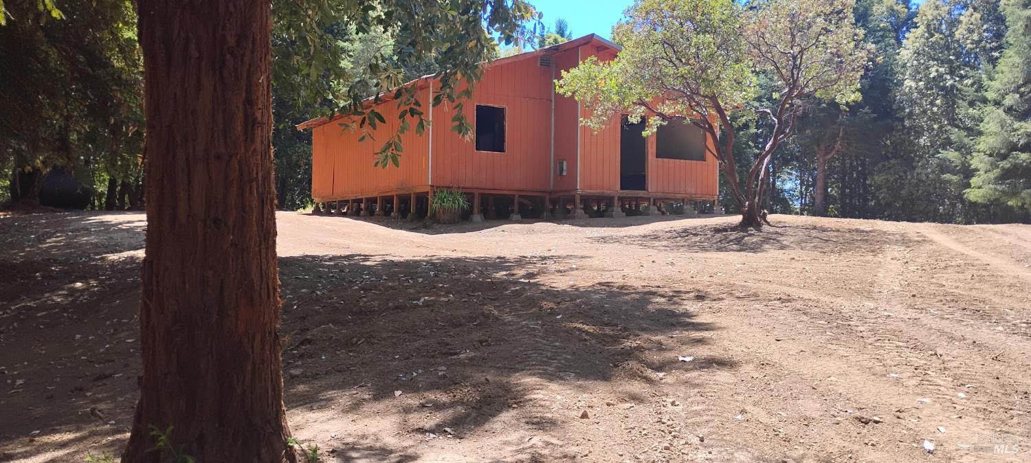 9660 Branscomb Road Laytonville, CA 95454 - Photo 4 of 33 a view of a house with a yard covered in snow