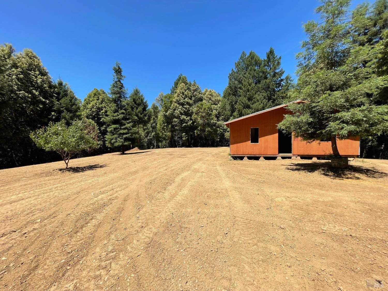 9660 Branscomb Road Laytonville, CA 95454 - Photo 6 of 33 a swimming pool with trees in the background