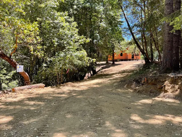 a view of house with yard