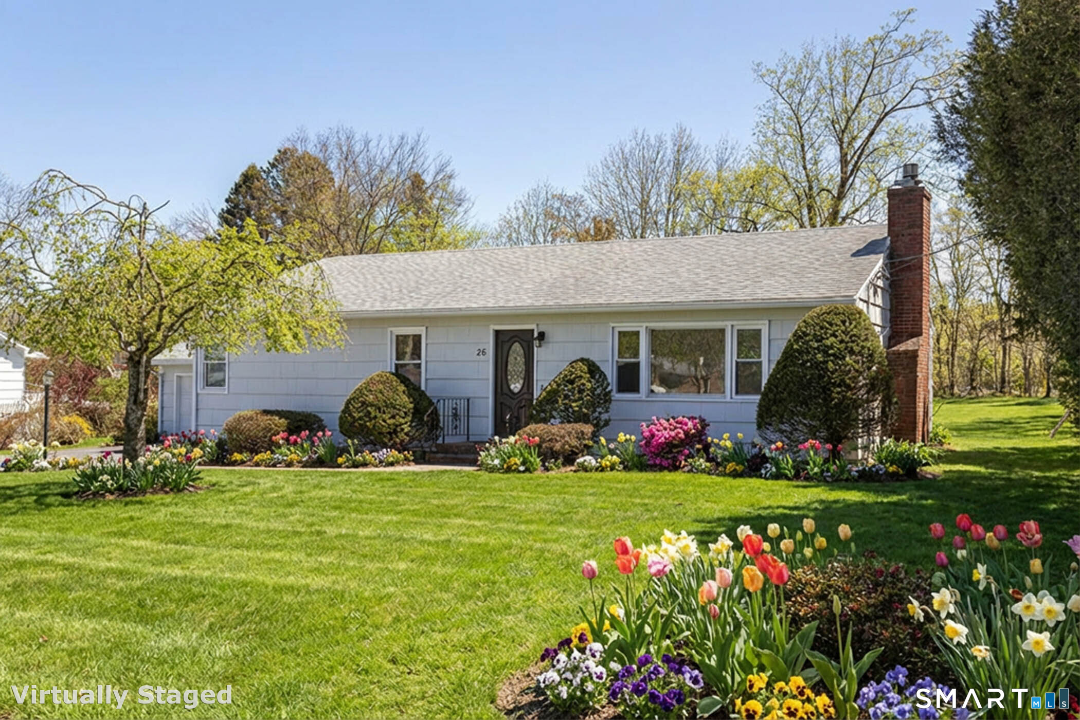 26 Kelly Road Hamden, CT 06518 - Photo 1 of 37 a front view of a house with garden and trees