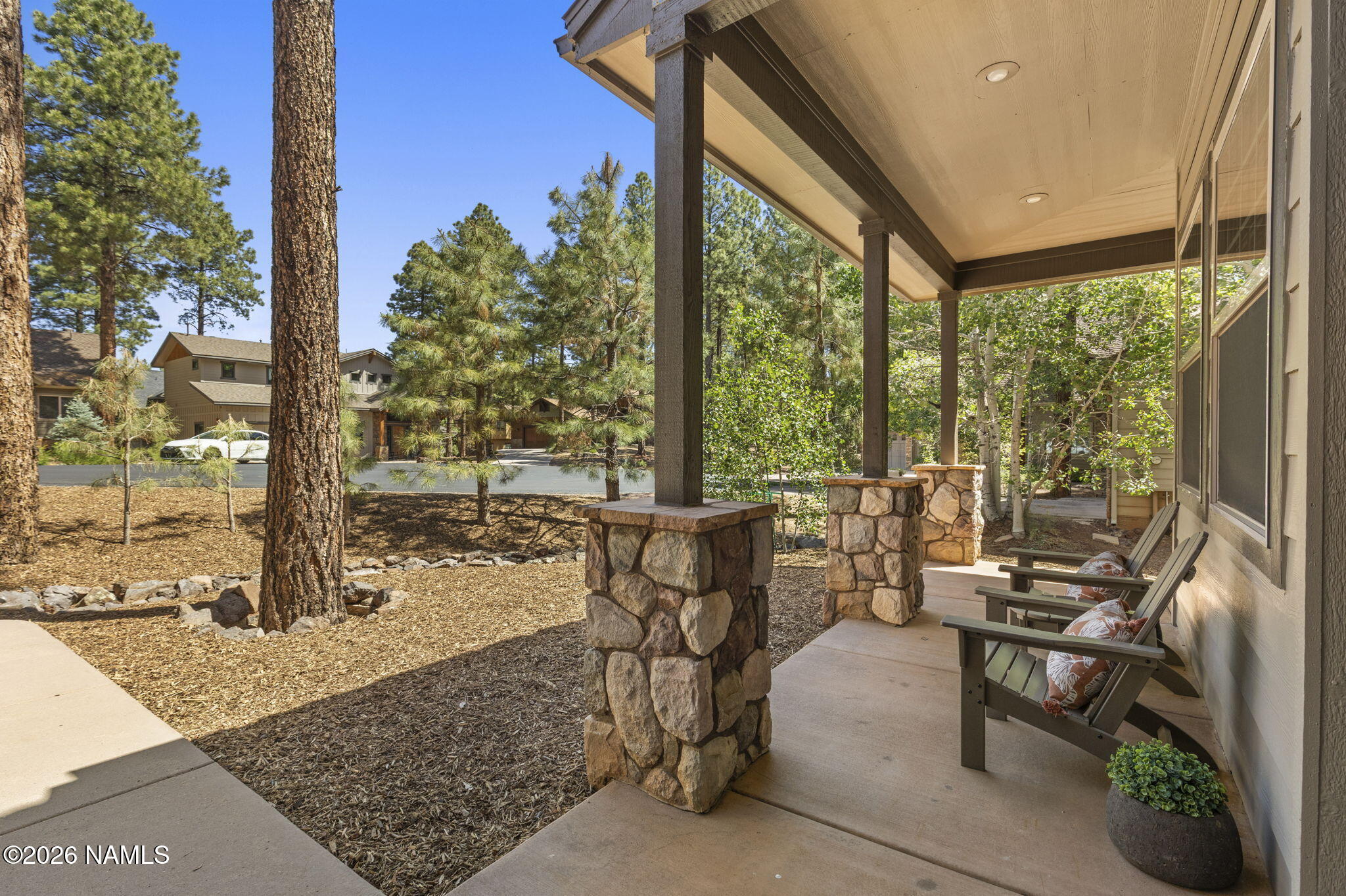 3495 West Lead Rope Flagstaff, AZ 86005 - Photo 7 of 49 a building outdoor space with patio furniture and potted plants