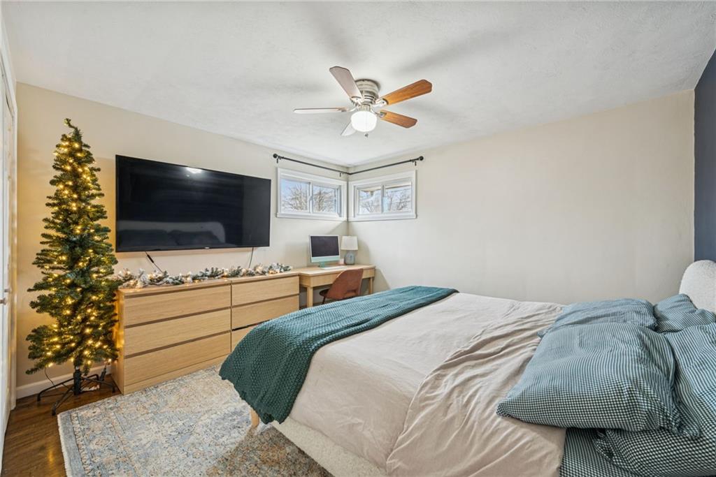 1000 Colfax Street Springdale, PA 15144 - Photo 12 of 25 a bedroom with a bed and a flat screen tv