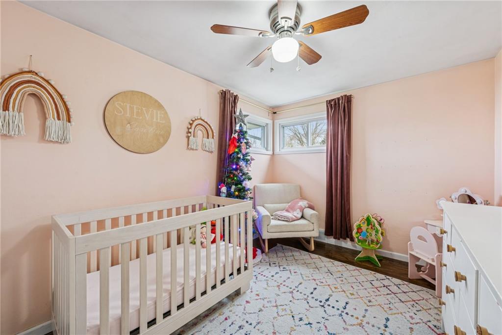 1000 Colfax Street Springdale, PA 15144 - Photo 14 of 25 a bedroom with furniture and a window
